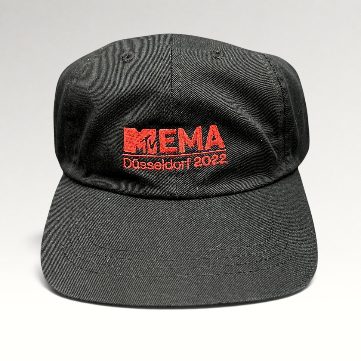 Raree Finds black Beechfield strapback hat with red embroidered MTV EMA Düsseldorf 2022 logo on the front panel.