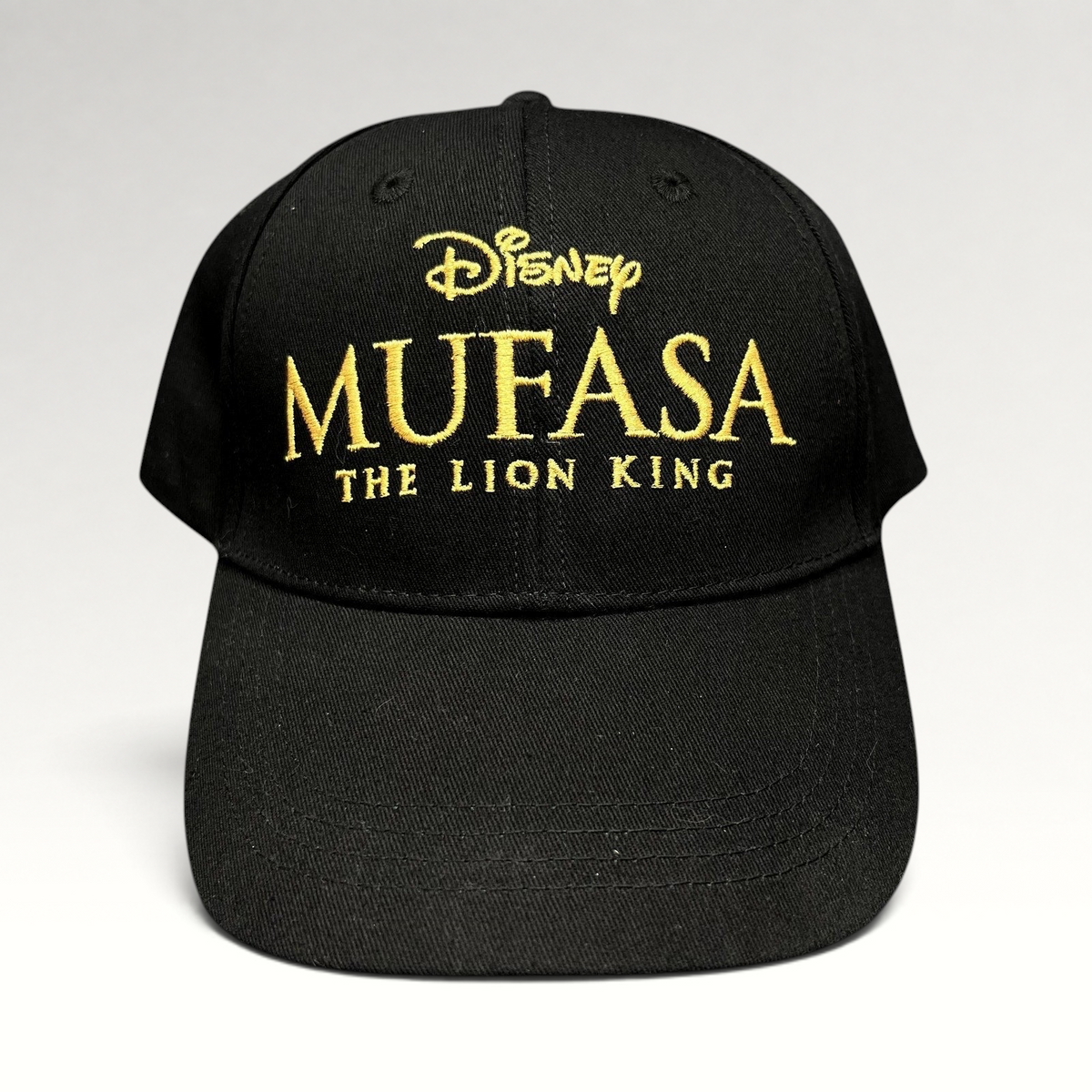 Raree Finds Disney Mufasa The Lion King 2024 promo strapback hat in black cotton with gold embroidered front logo.