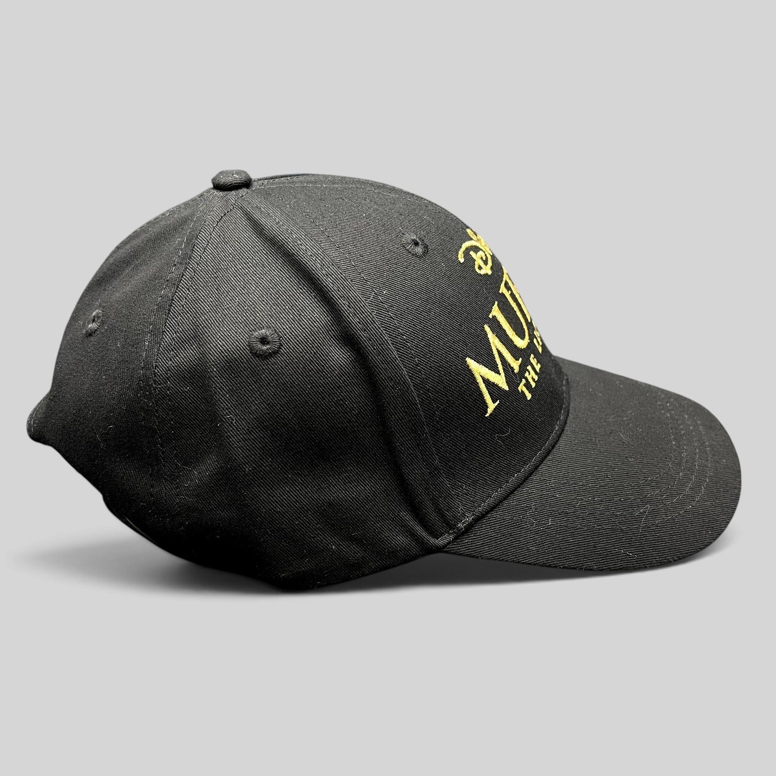 Raree Finds Disney Mufasa The Lion King 2024 black cotton strapback hat with gold embroidered movie title lettering
