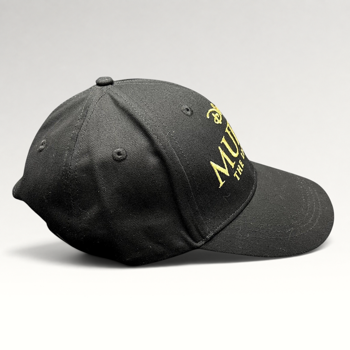 Raree Finds Disney Mufasa The Lion King 2024 black cotton strapback hat with gold embroidered movie title lettering