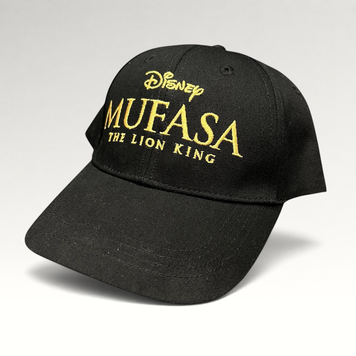 Raree Finds Disney Mufasa The Lion King 2024 promotional black cotton strapback hat with gold embroidered lettering.