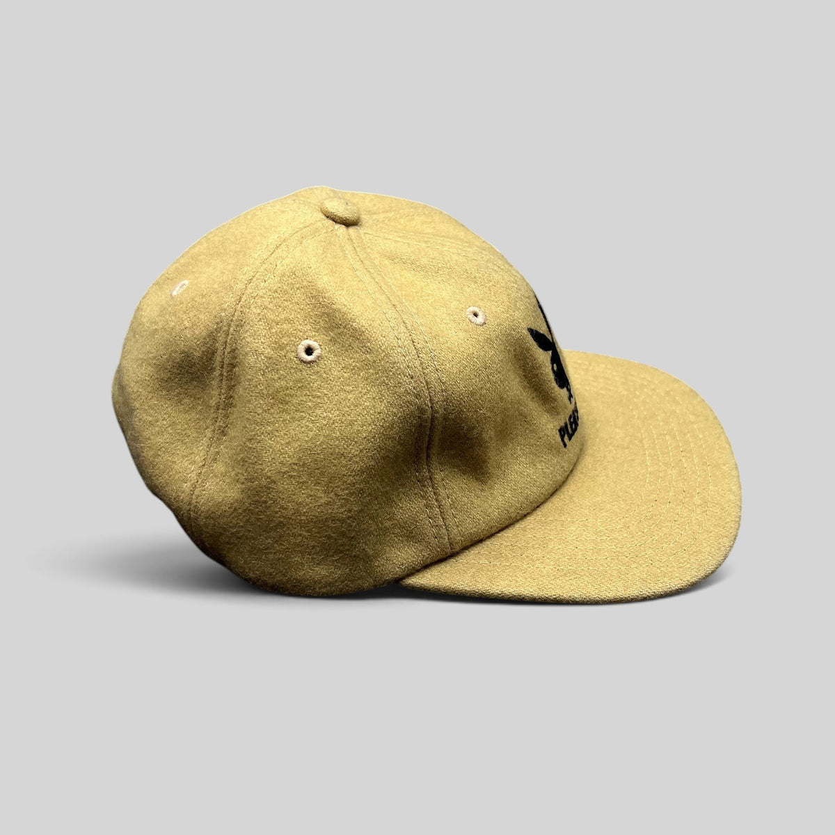 Raree Finds PLEASURES x Playboy mustard wool strapback hat with black embroidered bunny logo and leather strap