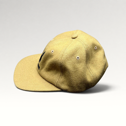 Raree Finds PLEASURES x Playboy mustard Melton wool strapback hat with black embroidered bunny logo and curved brim