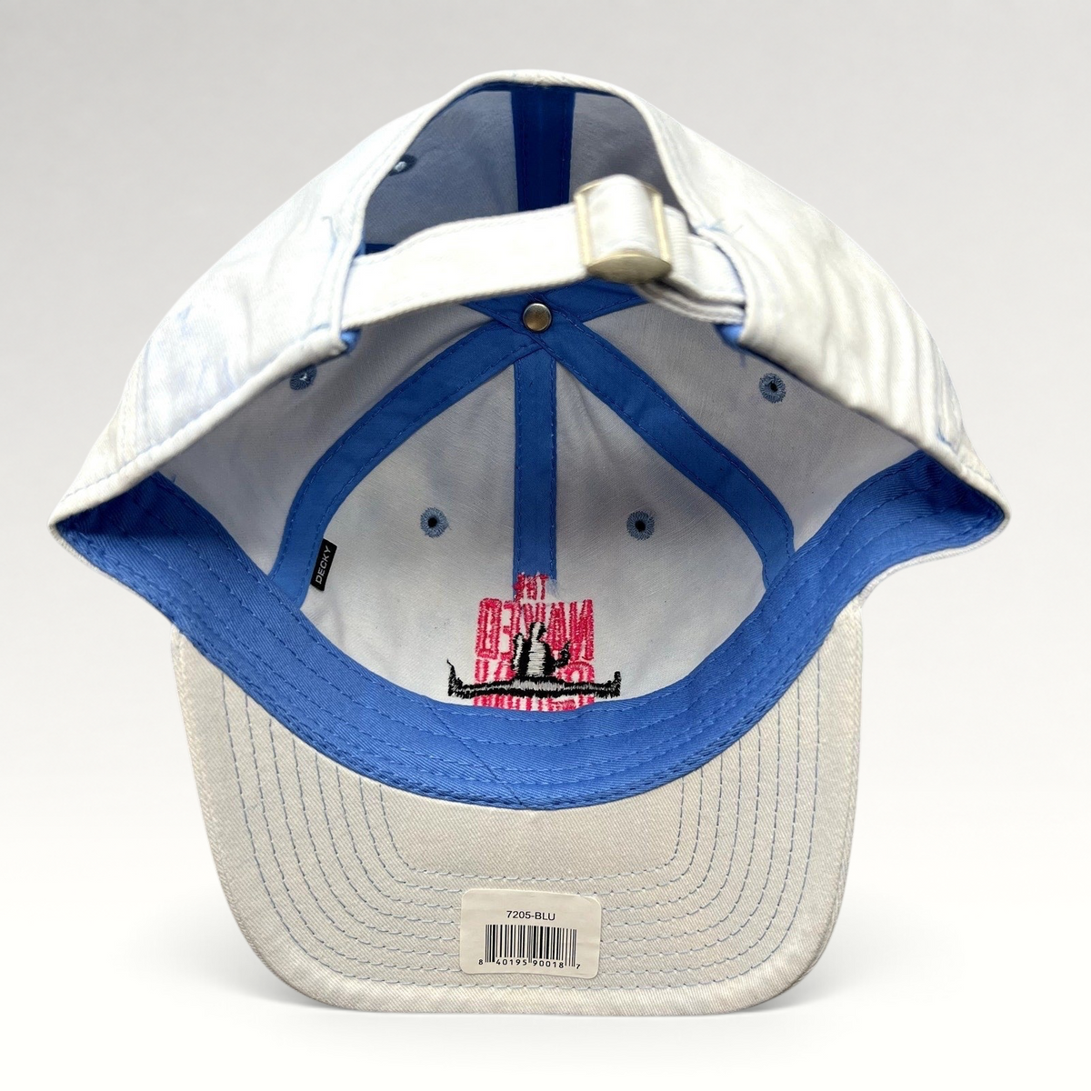 Raree Finds white cotton strapback hat from The Naked Gun 2025 movie with blue trim and pink interior embroidery