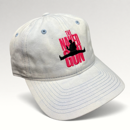 Raree Finds white cotton strapback hat with pink The Naked Gun embroidery and light blue stitching details.
