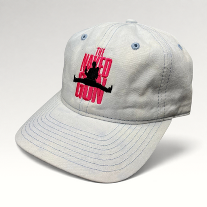 Raree Finds white cotton strapback hat with pink The Naked Gun embroidery and light blue stitching details.
