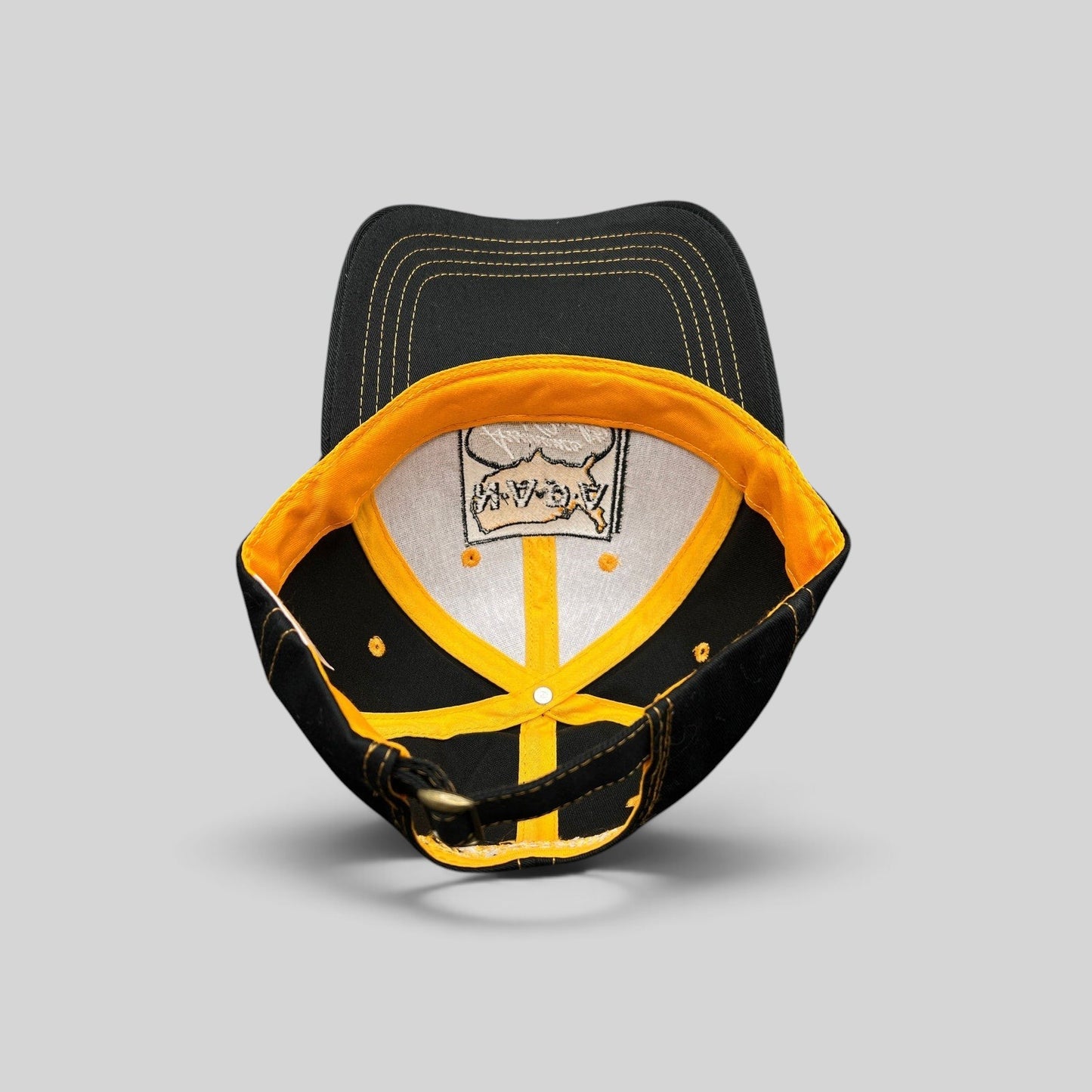 Raree Finds vintage NAPA Auto Parts strapback cap interior showing yellow taped seams and cotton construction