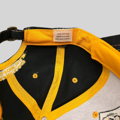Raree Finds vintage NAPA Auto Parts cap interior showing yellow taped seams, cotton label, and metal strapback buckle