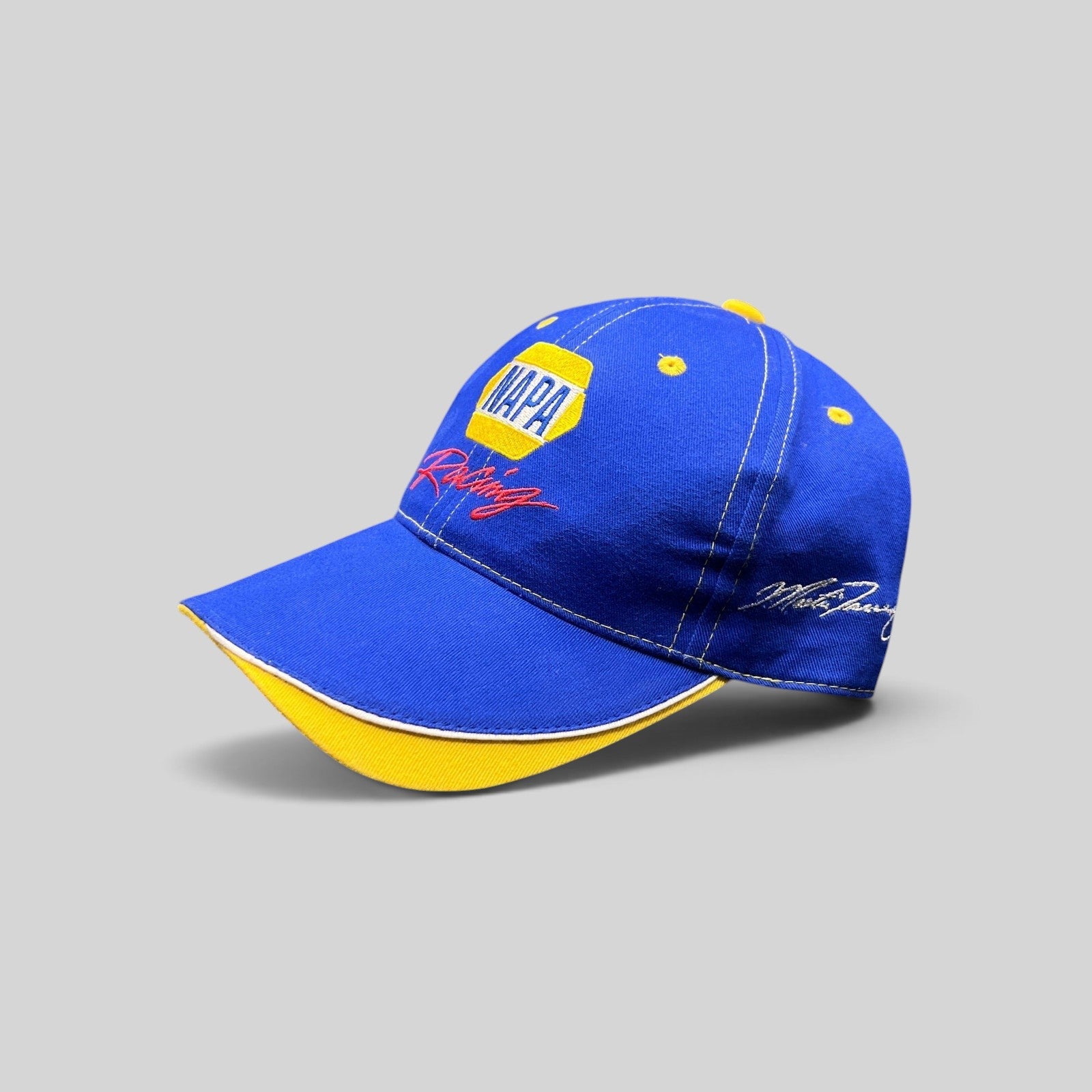 Raree Finds vintage royal blue NAPA Racing strapback hat with yellow accents and Ron Capps signature embroidery.