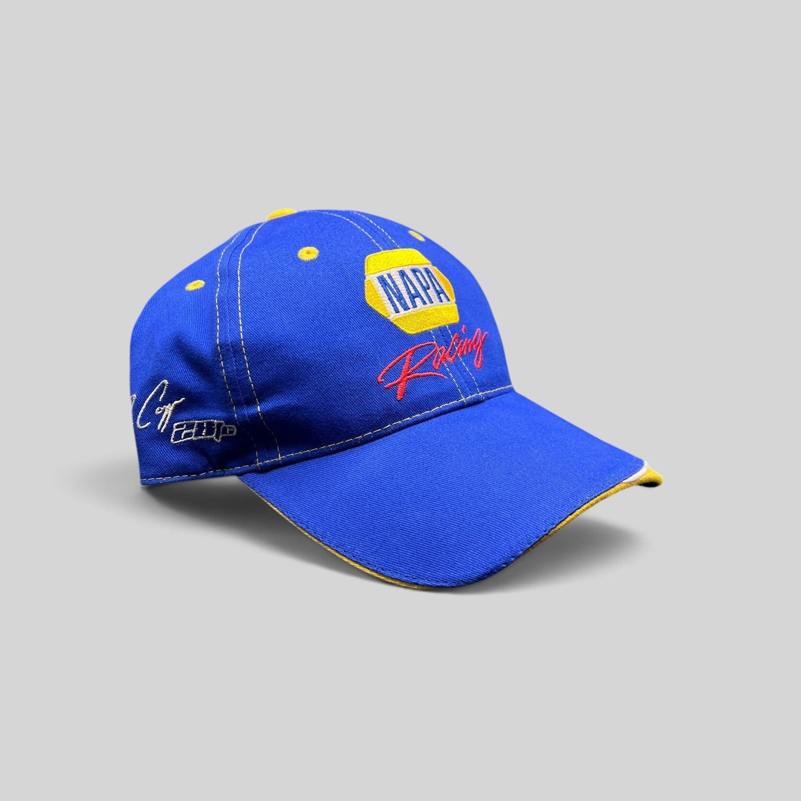 Raree Finds vintage royal blue NAPA Racing strapback hat with yellow accents and Ron Capps signature embroidery.