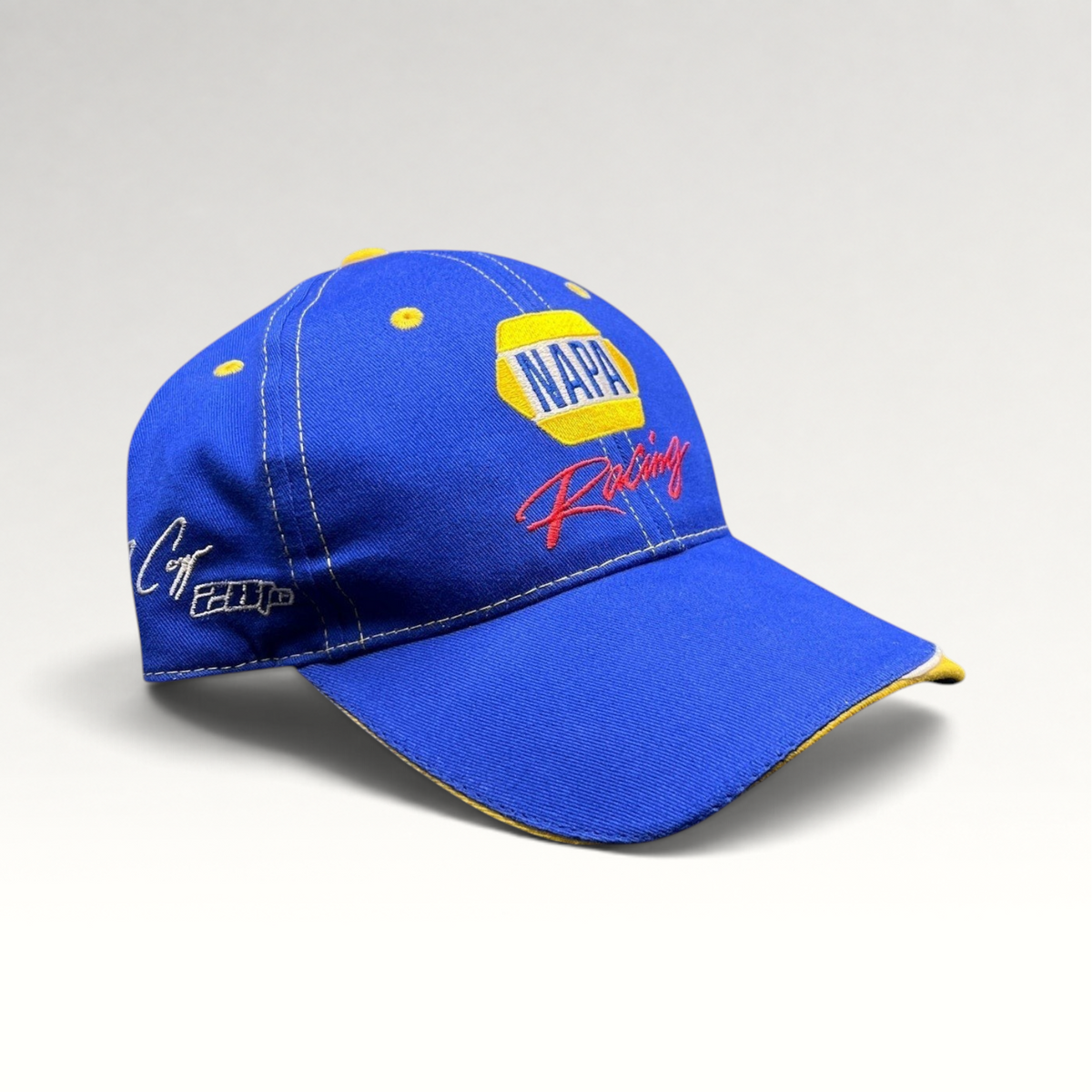 Raree Finds vintage royal blue NAPA Racing strapback hat with yellow accents and Ron Capps signature embroidery.