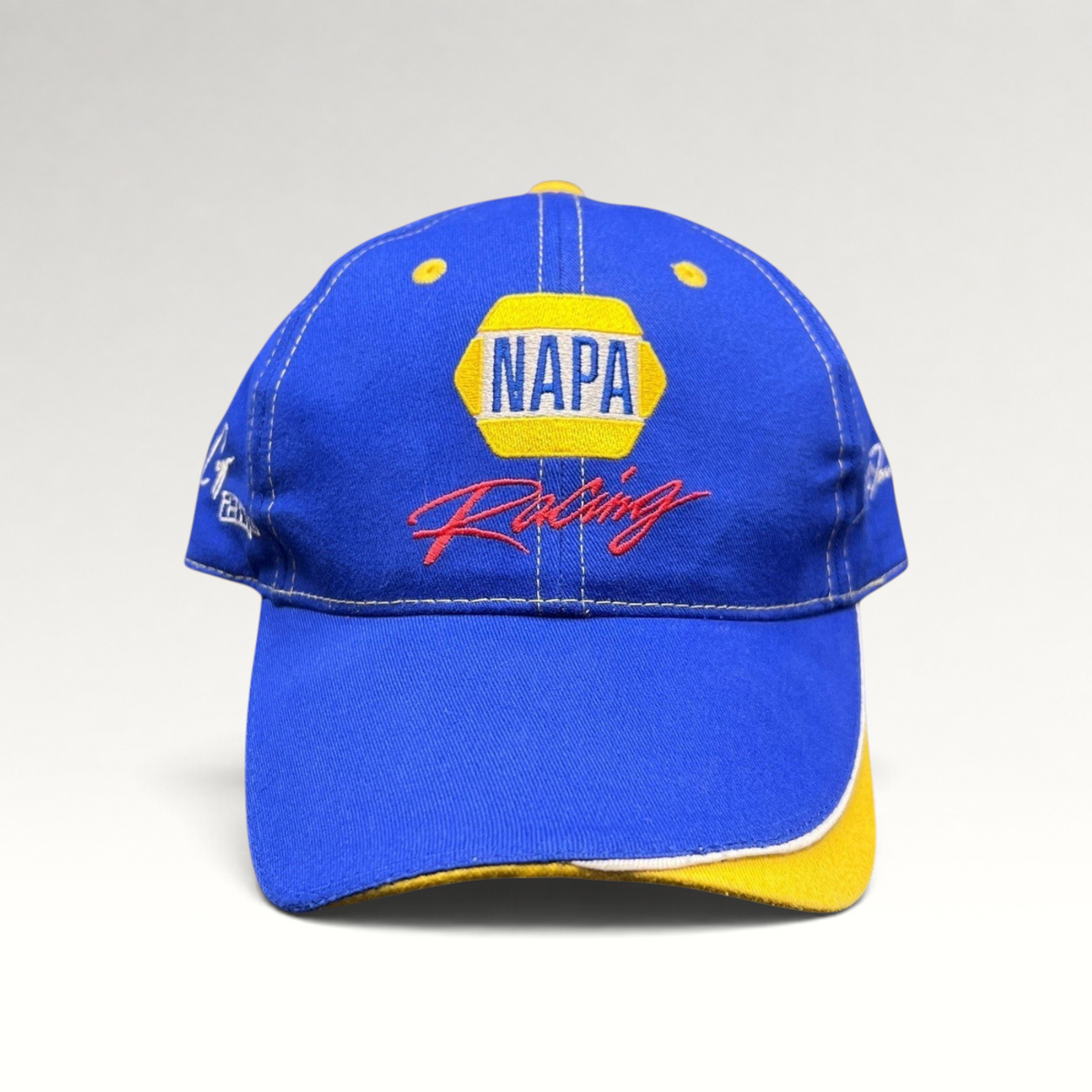 Raree Finds vintage royal blue NAPA Racing strapback hat with yellow underbrim and Ron Capps signature embroidery.