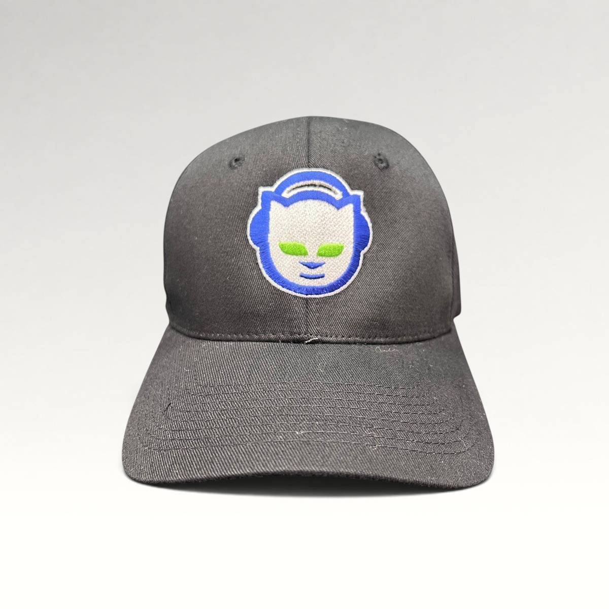Raree Finds vintage Y2K black flex hat featuring an embroidered blue and green Napster cat logo on the front