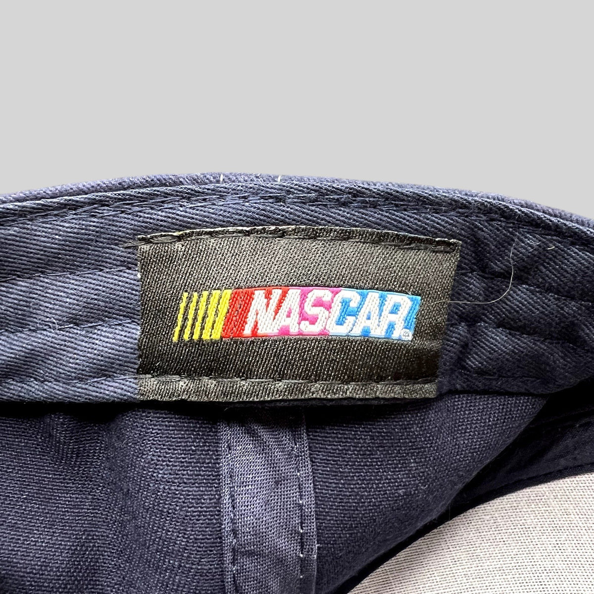 Raree Finds official NASCAR logo woven label stitched inside a navy blue Dale Earnhardt Jr. adjustable hat