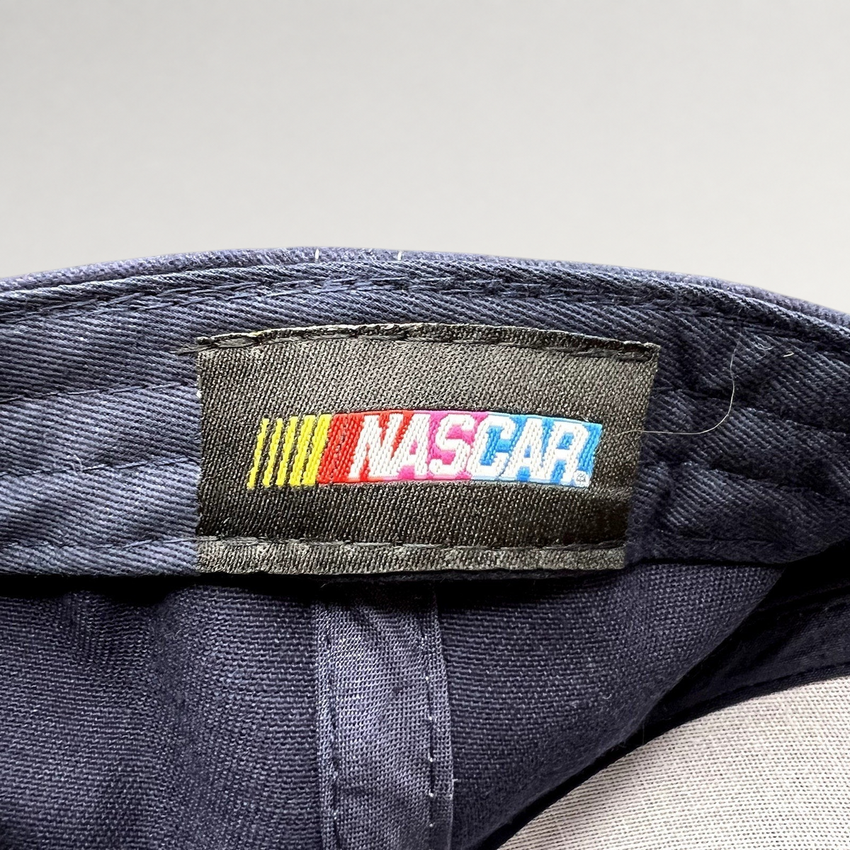 Raree Finds official NASCAR logo fabric tag stitched inside a navy blue Dale Earnhardt Jr. adjustable hat