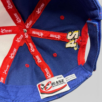 Interior view of a Raree Finds vintage Chase Authentics NASCAR snapback hat showing red branded taping and labels.