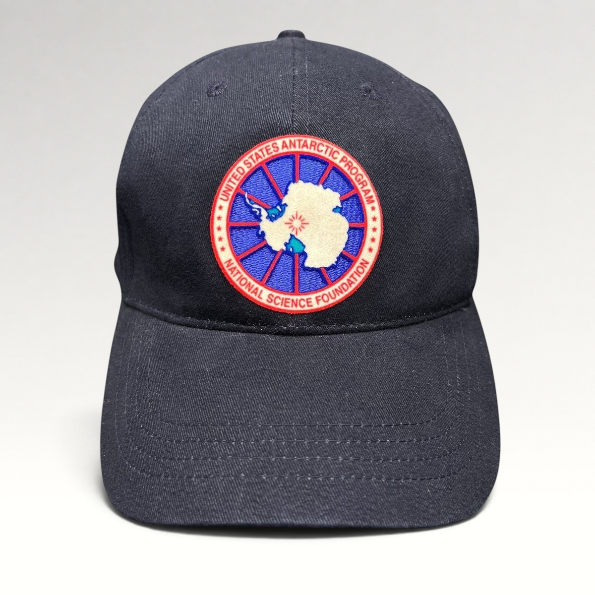 Raree Finds navy blue cotton strapback hat featuring an embroidered United States Antarctic Program NSF patch