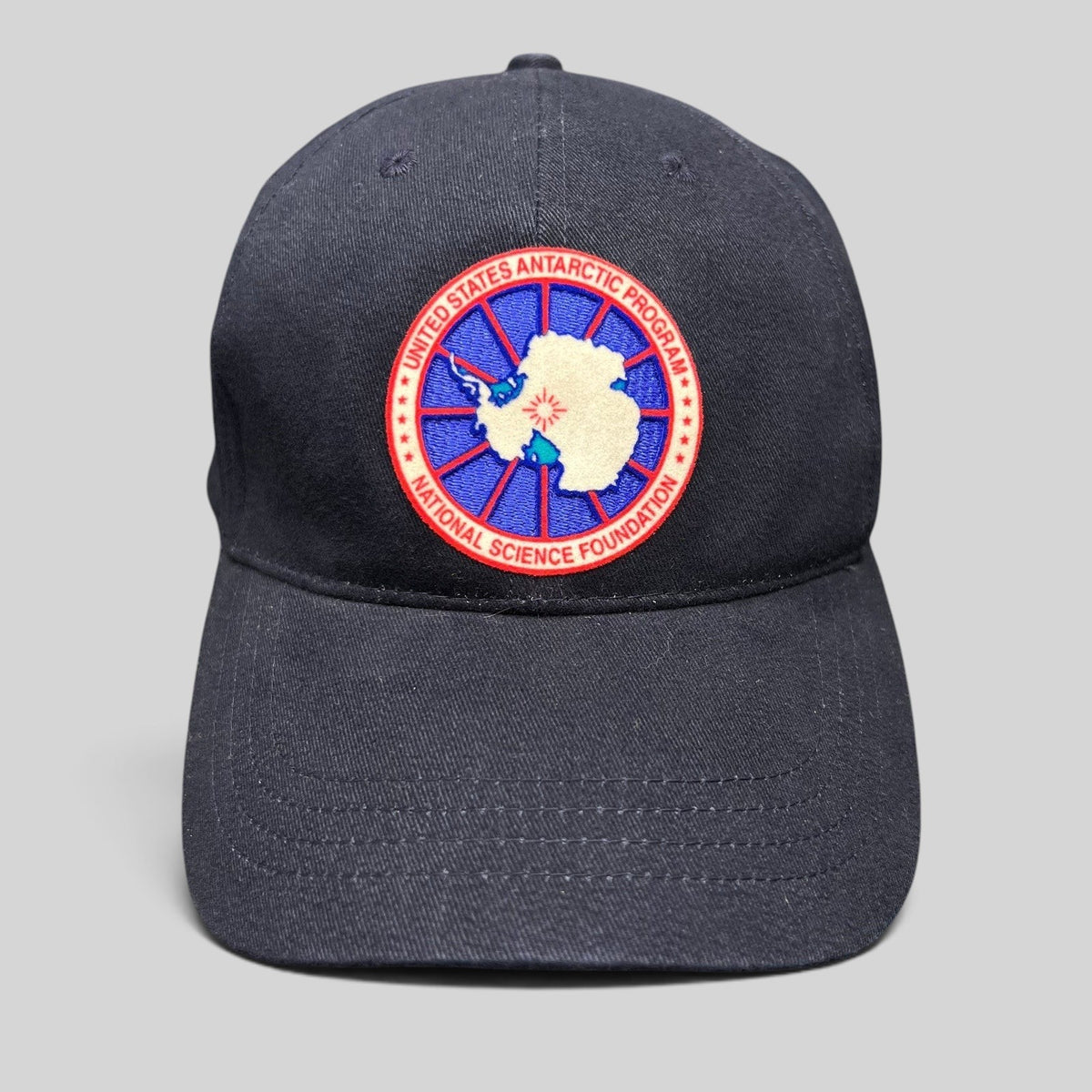 Raree Finds navy blue cotton strapback hat featuring an embroidered United States Antarctic Program NSF patch