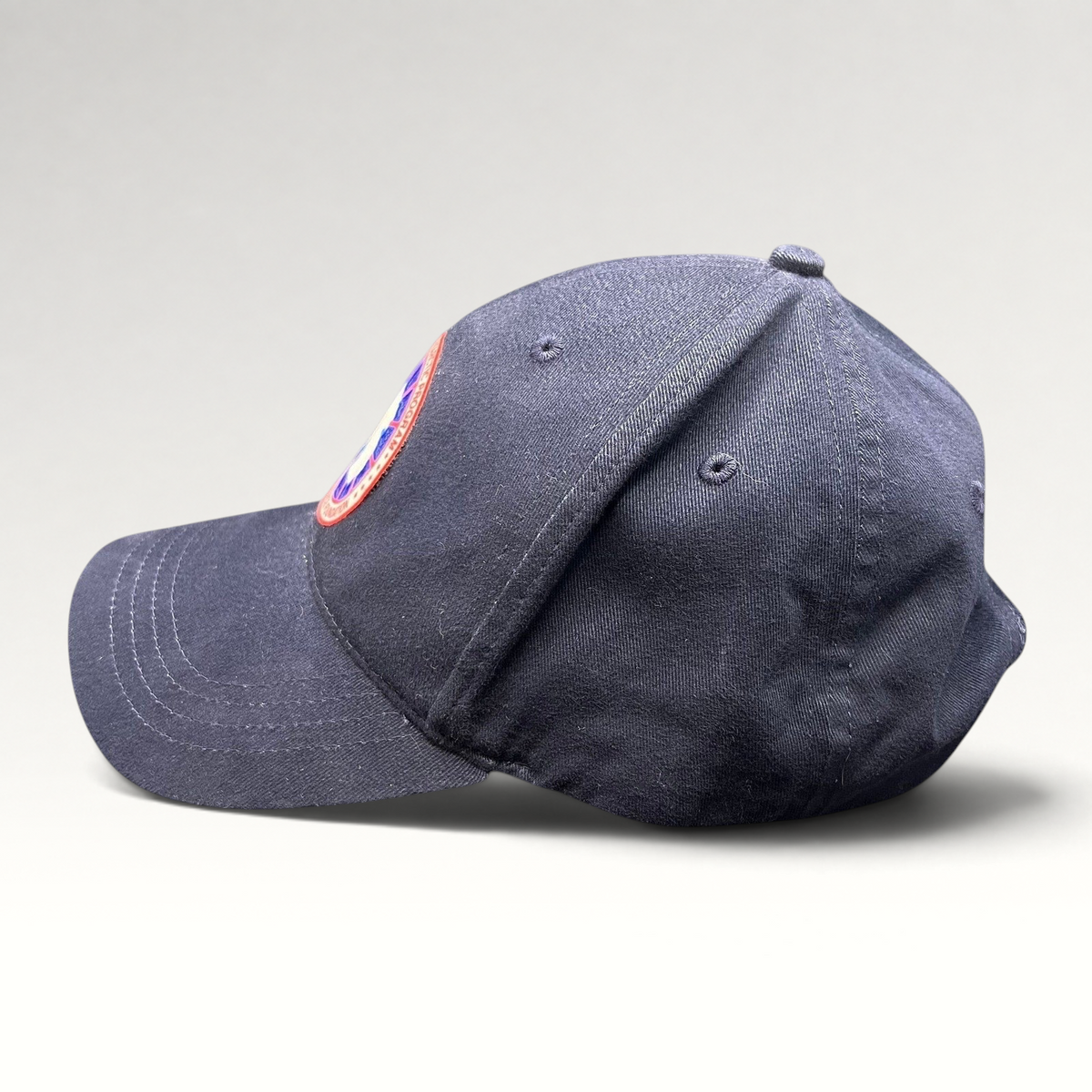 Raree Finds navy blue cotton strapback hat with US Antarctic Program NSF patch, side profile view.