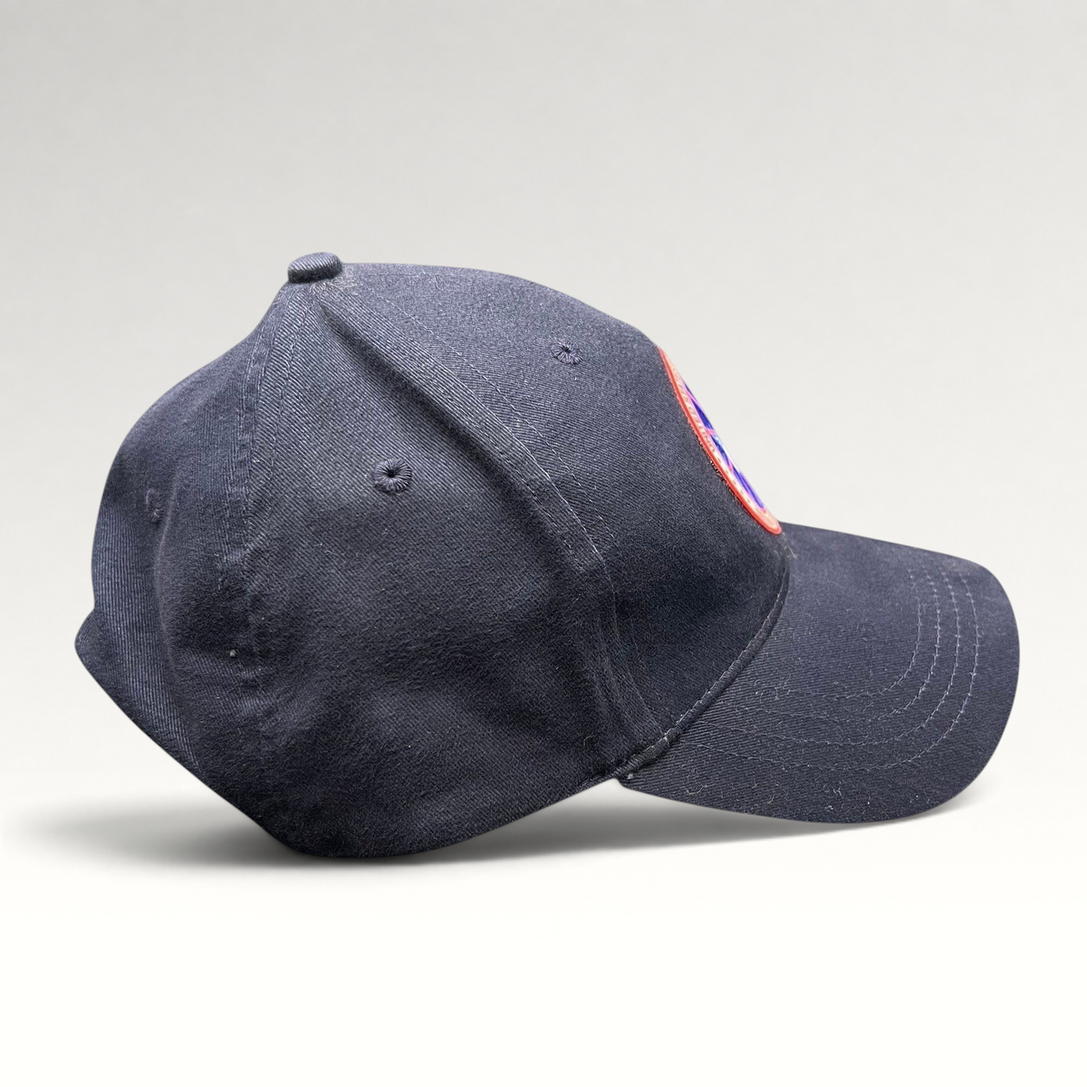 Raree Finds navy blue cotton strapback hat with US Antarctic Program NSF patch, side profile view.