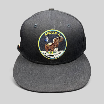 Raree Finds navy blue New Era 59FIFTY fitted hat featuring an embroidered Apollo 11 moon mission patch on the front.
