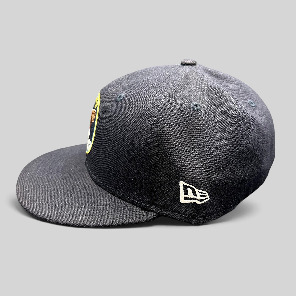 Raree Finds navy blue New Era 59FIFTY fitted hat featuring an Apollo 11 mission patch and side logo embroidery