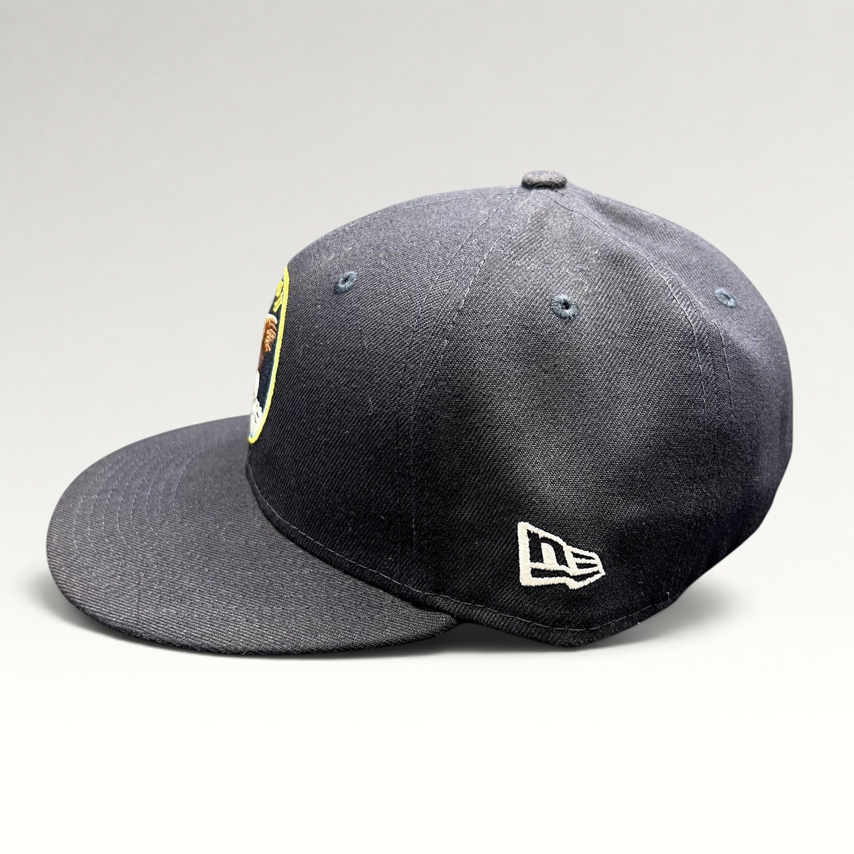 Raree Finds navy blue New Era 59FIFTY fitted hat featuring an Apollo 11 mission patch and side logo embroidery
