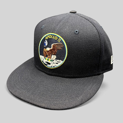 Raree Finds navy blue New Era 59FIFTY fitted hat featuring an embroidered Apollo 11 mission patch on the front.
