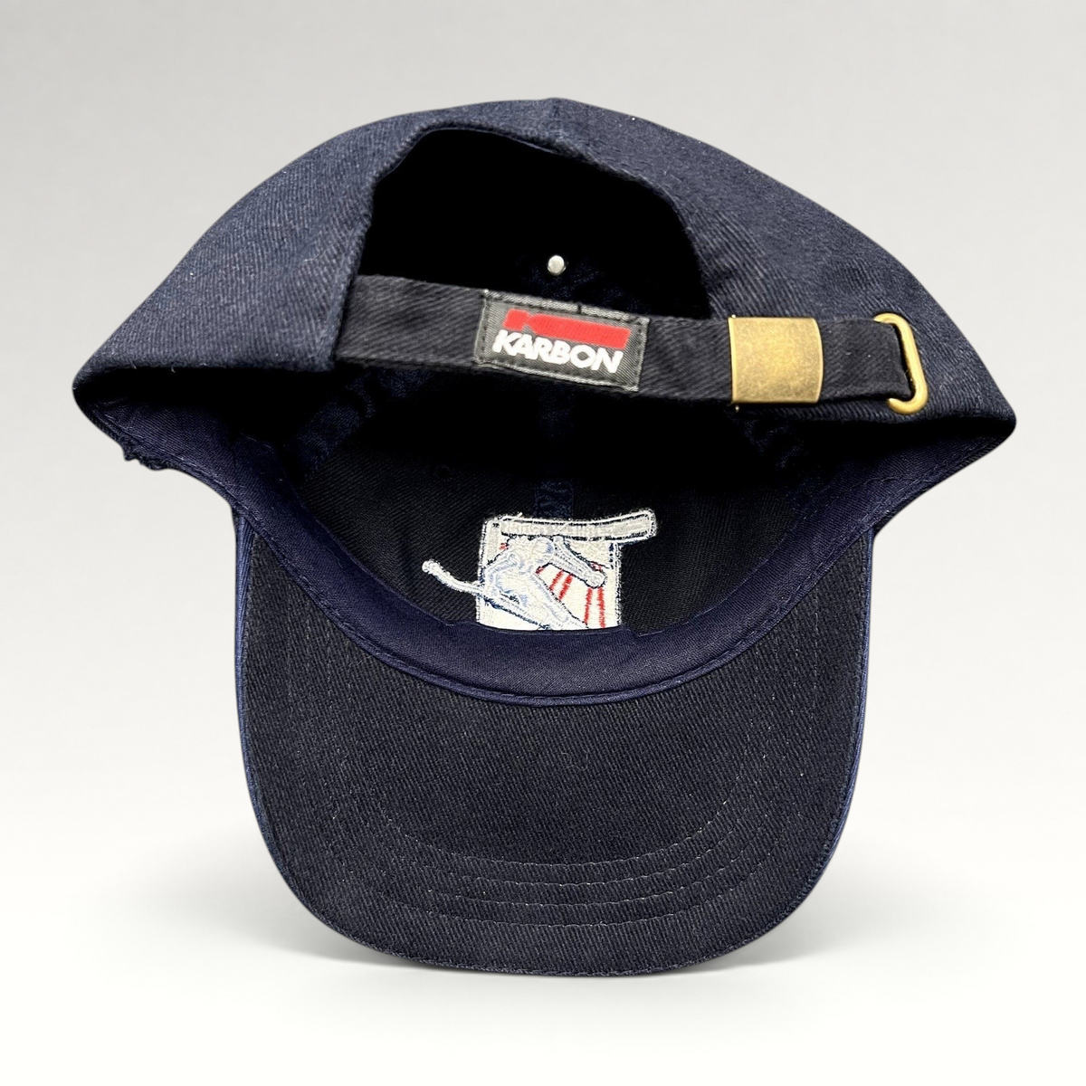Raree Finds navy blue 2002 Aspen Winternational cotton strapback hat with Karbon branding and brass buckle closure