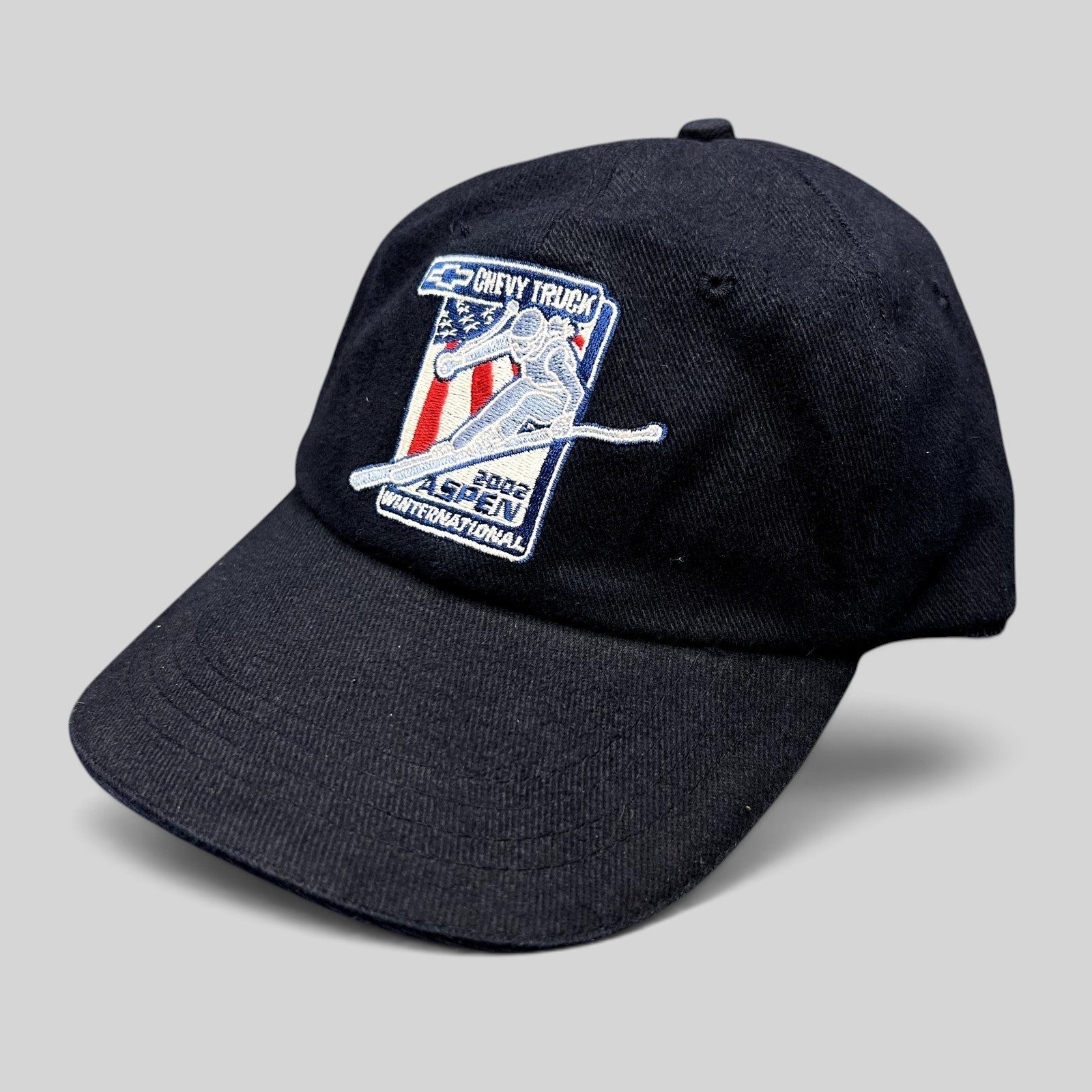 Raree Finds navy blue 2002 Aspen Winternational cotton strapback hat with Chevy Truck and alpine skier embroidery.
