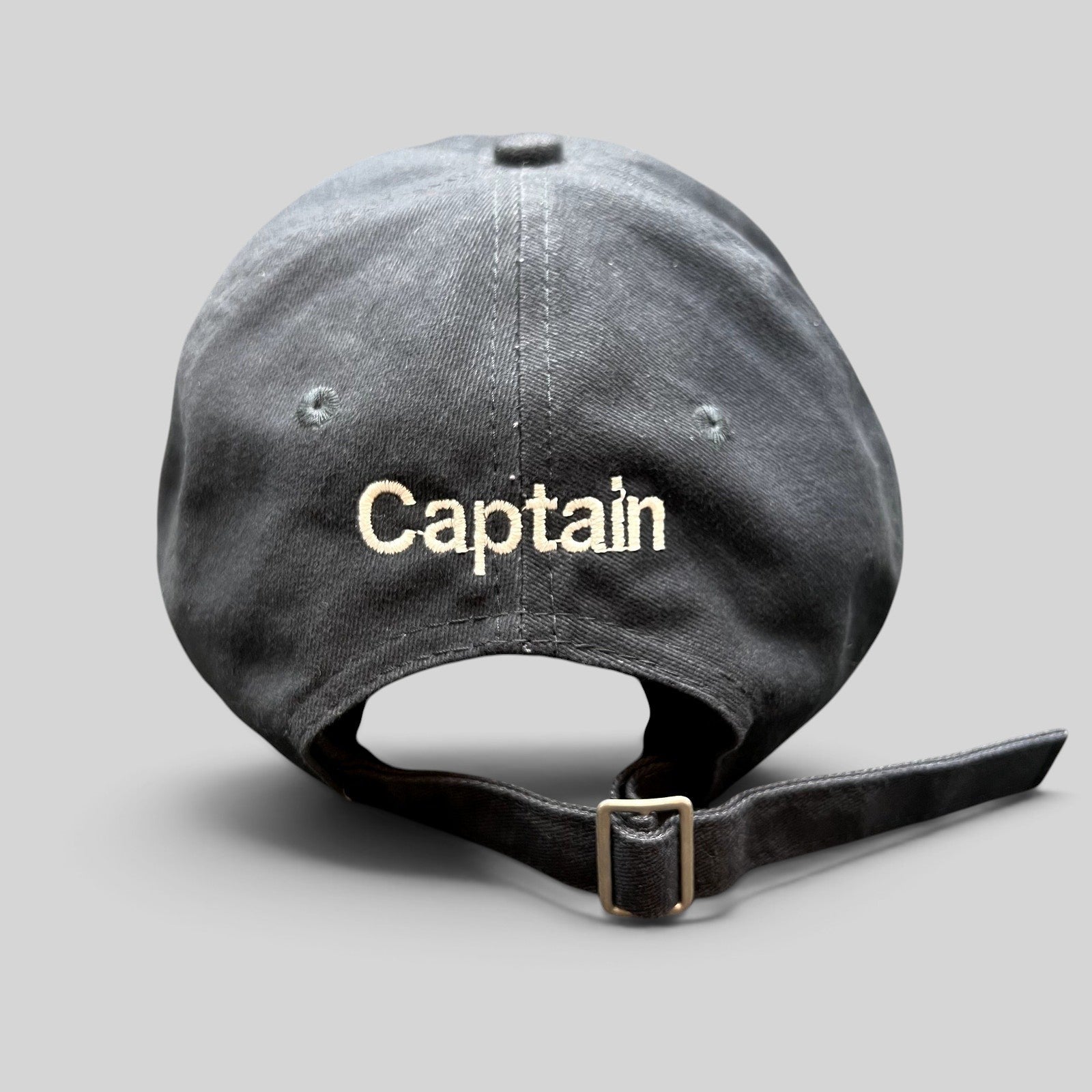 Raree Finds navy blue cotton strapback hat with Captain embroidery on the back and adjustable metal buckle closure