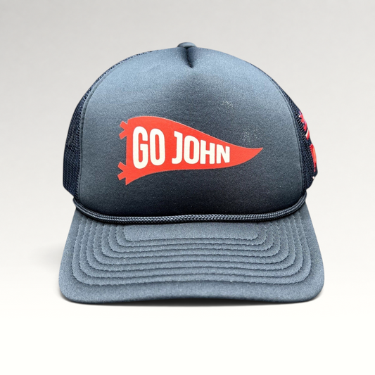 Raree Finds navy blue vintage-style trucker hat with a red Go John pennant graphic and braided rope brim detail.