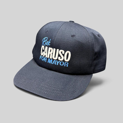Raree Finds navy blue Rick Caruso for Mayor campaign strapback hat with embroidered text and adjustable closure.