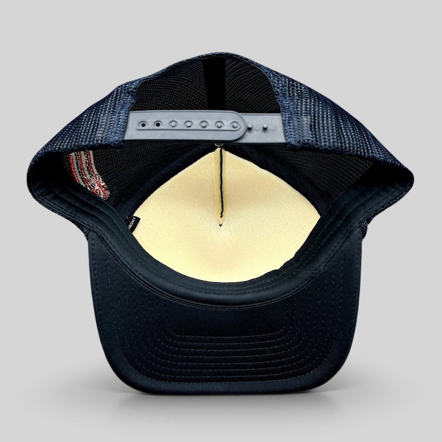 Raree Finds vintage navy blue trucker hat with mesh back, adjustable snapback closure, and side American flag detail