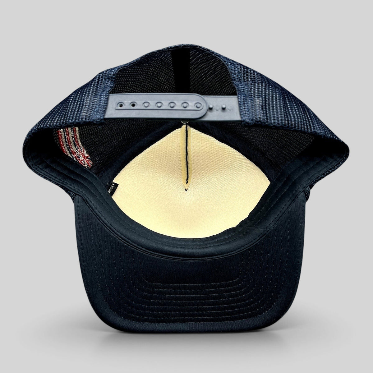 Raree Finds vintage navy blue trucker hat with mesh back, adjustable snapback closure, and side American flag detail
