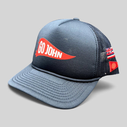 Raree Finds navy blue vintage trucker hat with red Go John pennant graphic, mesh back, and American flag side detail.