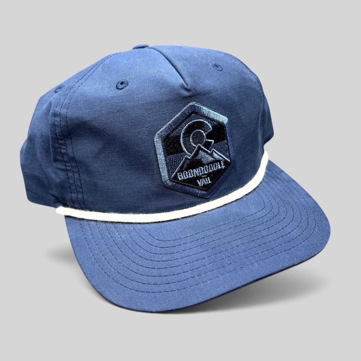 Raree Finds navy Boondoggle Vail snapback hat with white rope detail and Colorado mountain logo patch