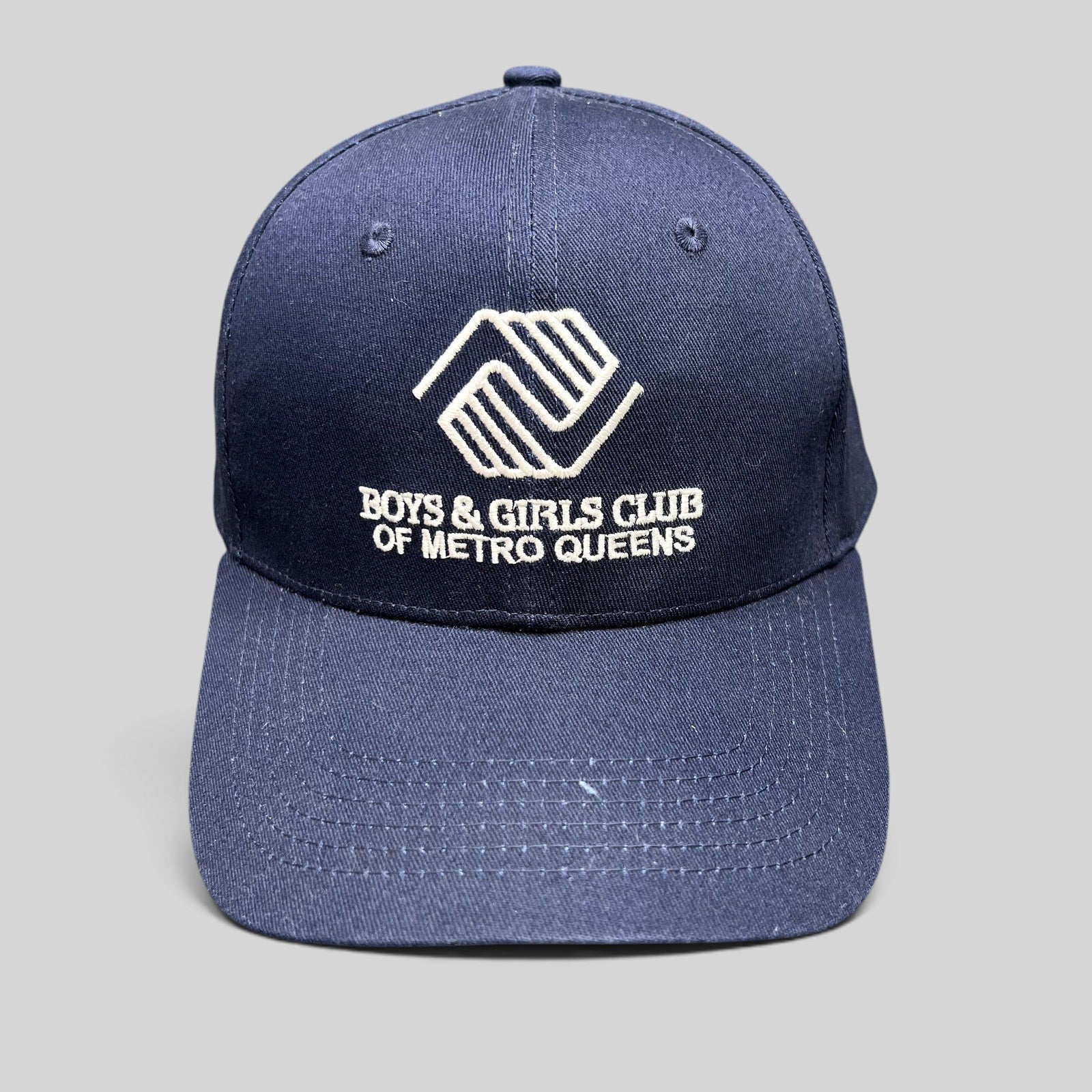 Raree Finds navy blue Boys & Girls Club of Metro Queens strapback hat with white embroidered logo and curved brim
