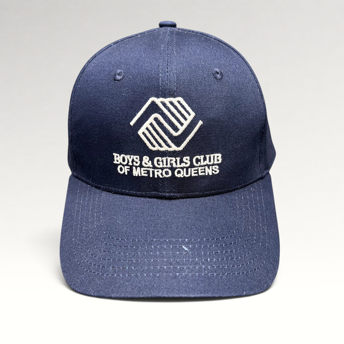 Raree Finds navy blue Boys & Girls Club of Metro Queens strapback hat with white embroidered logo and curved brim