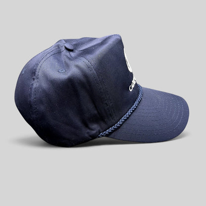 Raree Finds vintage navy blue Cadiz & Lluis snapback hat by Nissin Cap with white embroidery and braided rope detail.
