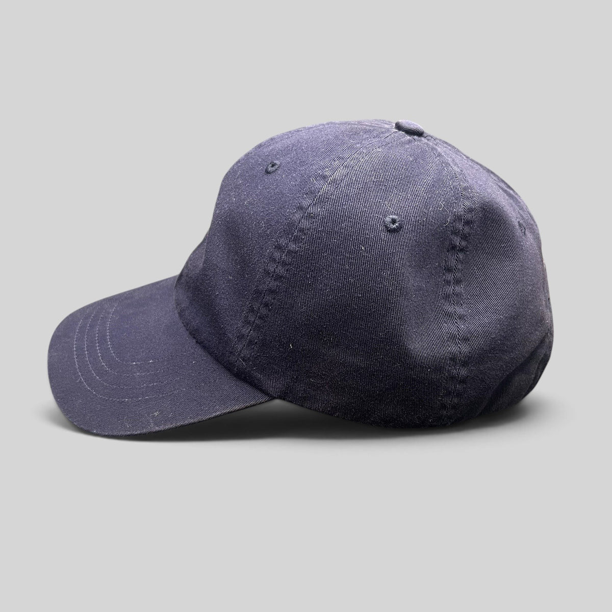 Raree Finds navy cotton chino baseball cap with a classic low-profile design and stitched brim detail