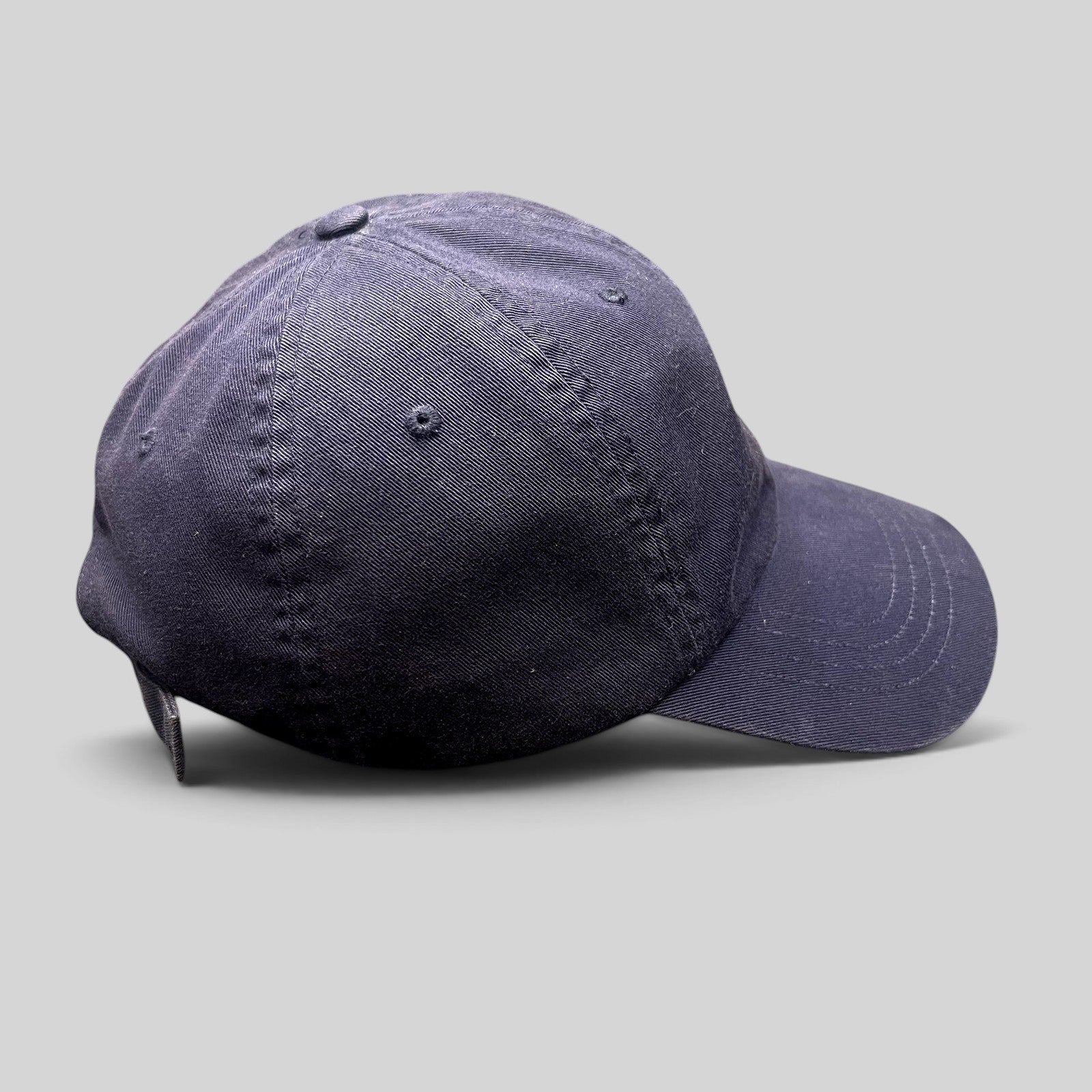 Raree Finds navy cotton chino baseball cap with an adjustable strapback and brass-tone buckle