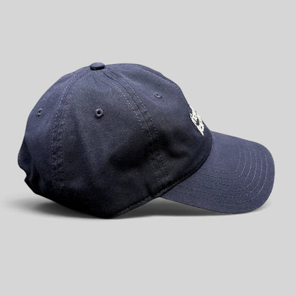 Raree Finds navy blue cotton twill dad hat with white embroidered text and a relaxed unstructured fit.