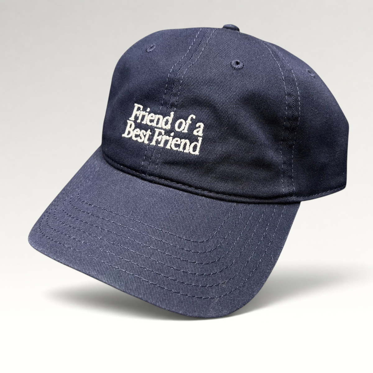 Raree Finds navy blue cotton twill dad hat with white Friend Of A Best Friend embroidery and curved brim