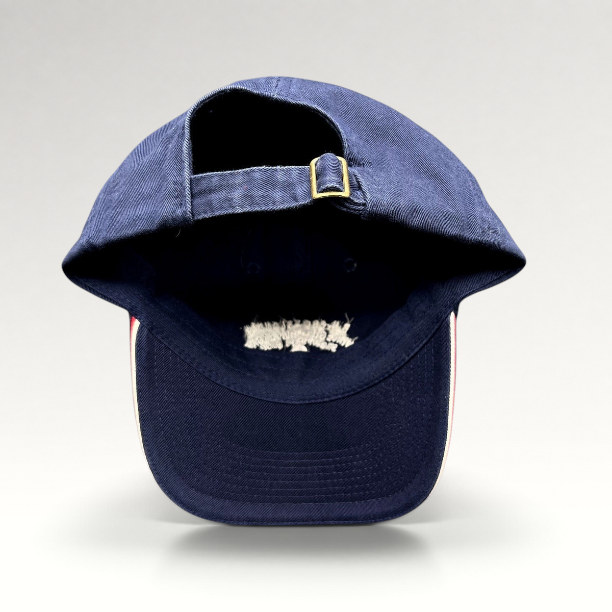 Raree Finds vintage navy blue cotton strapback golf hat with adjustable brass buckle closure