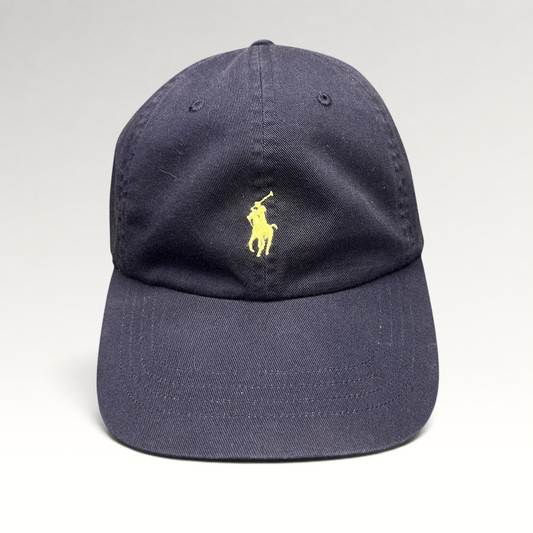 Raree Finds navy cotton chino baseball cap with a yellow embroidered Polo Ralph Lauren pony logo on the front.