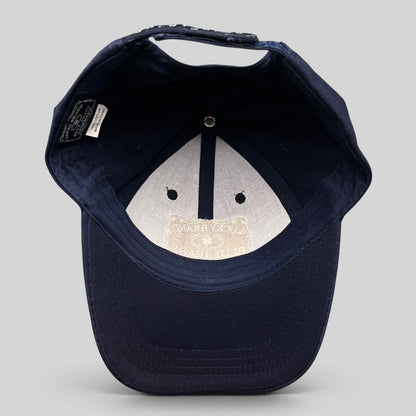 Raree Finds navy cotton snapback cap interior showing Lucky Brand label and white embroidered logo on the brim