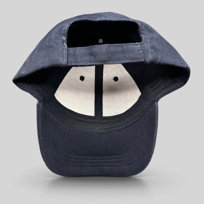 Raree Finds navy blue cotton strapback hat showing the interior lining and adjustable back strap