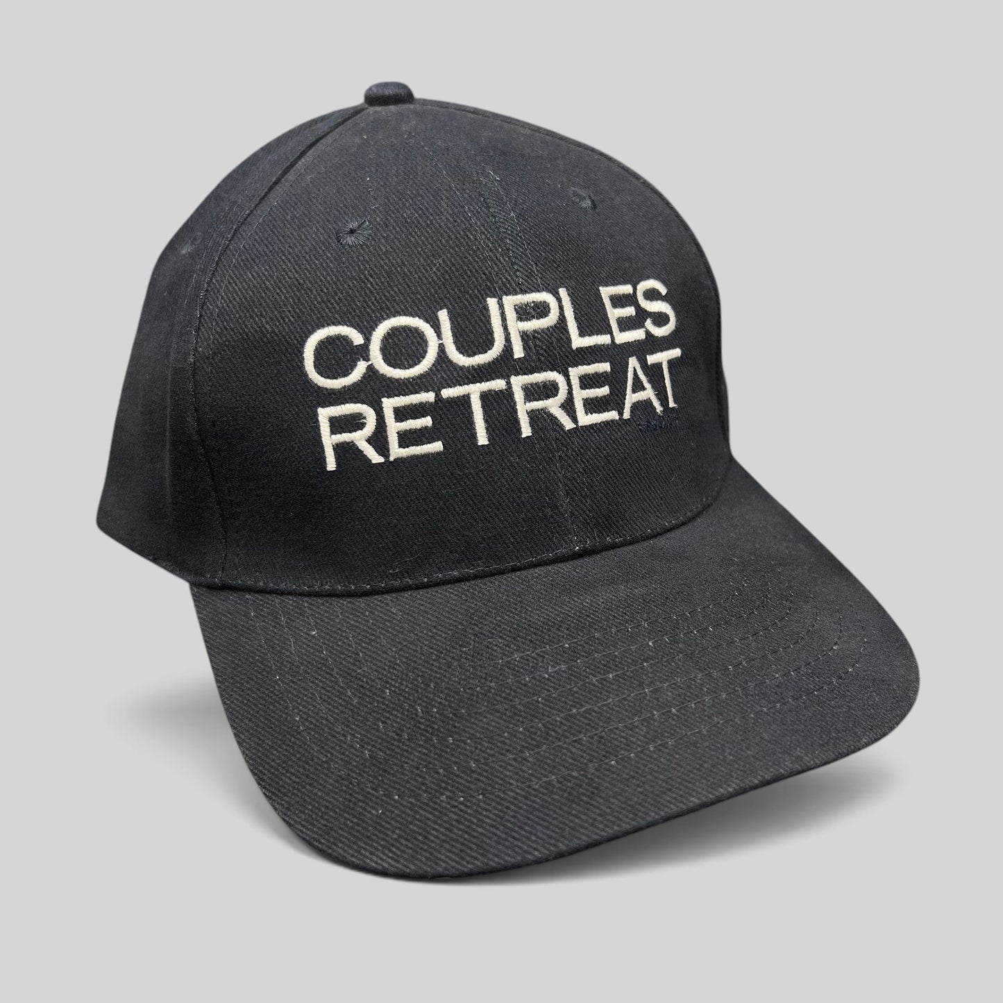 Raree Finds navy cotton strapback hat with white Couples Retreat film embroidery and unstructured crown