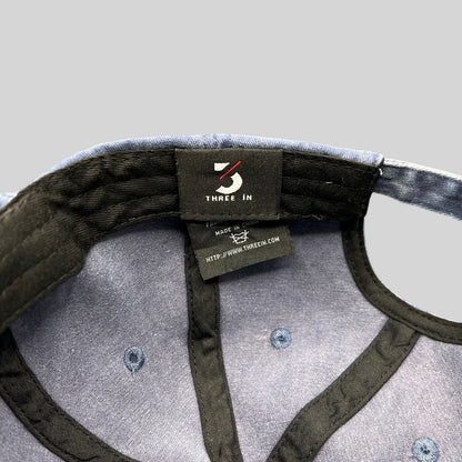 Raree Finds navy dad hat interior showing Three In brand label and stitching details